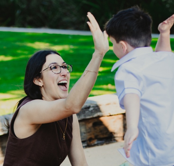 kid and parent high five