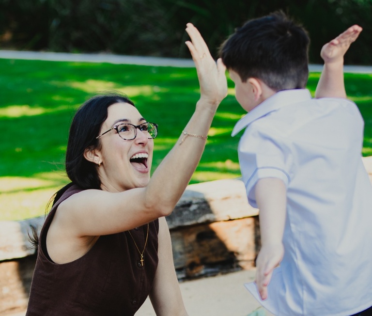 kid and parent high five